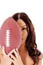 Beautiful nude woman holding american football ball. Royalty Free Stock Photo