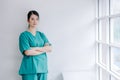 A beautiful nurse with arms crossed with a sad, tired and anxious expression, unhappy at work concept Royalty Free Stock Photo