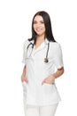 Beautiful nurse with stethoscope around neck holding hands in pockets. Royalty Free Stock Photo