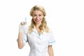 Beautiful nurse with syringe, white background. Royalty Free Stock Photo