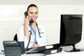 Beautiful nurse talking on phone with patient Royalty Free Stock Photo