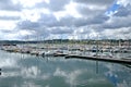 Beautiful ocean bay with small boats and sailing yachts. Sunny day with amazing sky and clouds. Brittany, France Royalty Free Stock Photo