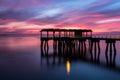 A beautiful ocean dramatic sunset and fishing pier at Jekyll Island