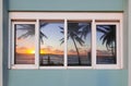 Beautiful Ocean Sunrise Reflected on Windows