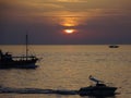 Beautiful ocean sunset with silhouttes