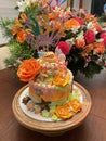 A beautiful ocean themed cake with orange roses