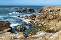 Beautiful oceanic landscape. Rocks jutting out of turquoise water off the coast of the Atlantic Ocean in France