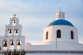 beautiful Oia town on Santorini island, Greece. Traditional white architecture and greek orthodox churches with blue domes over Royalty Free Stock Photo