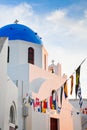 beautiful Oia town on Santorini island, Greece. Traditional white architecture and greek orthodox churches with blue domes over Royalty Free Stock Photo