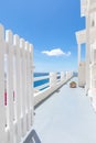 Beautiful Oia town on Santorini island, Greece. White entrance and stairs with sea view, wonderful scenery, vertical travel Royalty Free Stock Photo