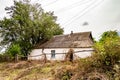 Beautiful old abandoned building farm house in countryside on natural background Royalty Free Stock Photo