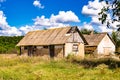 Beautiful old abandoned building farm house in countryside on natural background Royalty Free Stock Photo