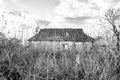 Beautiful old abandoned building farm house in countryside on natural background Royalty Free Stock Photo