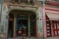 Beautiful old arched entrance to the building on the street in downtown Havana. Cuba Royalty Free Stock Photo