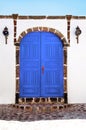Beautiful old blue door on white facade of greek architecture, Santorini island, Greece, Europe. Beautiful details of the island Royalty Free Stock Photo