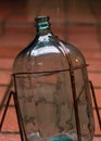 Beautiful old bottle of glass under the rain