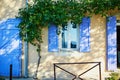 Beautiful old building with blue shutters in Bonnieux village, Provence, France Royalty Free Stock Photo