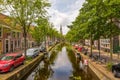 A beautiful historic  canal in the center of Delft, Netherlands with a view on the church tower Royalty Free Stock Photo