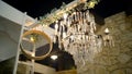 Beautiful old chandelier with crystals shines at night. Action. Romantic and old chandelier with crystals shines in open Royalty Free Stock Photo