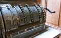 Beautiful, old counting machine with round buttons. Ancient cash register. Royalty Free Stock Photo