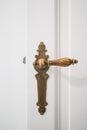 Beautiful old door handle on white door Royalty Free Stock Photo