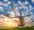 Beautiful old dutch windmill against colorful sky Royalty Free Stock Photo