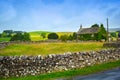 Beautiful, old English cottage with stone wall in Yorkshire, England, UK Royalty Free Stock Photo