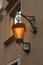 Beautiful old fashioned street lamp lighting on wall of building Royalty Free Stock Photo