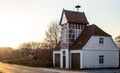 Beautiful old German house by the road at sunset. Royalty Free Stock Photo