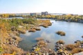 Beautiful old granite quarry with clear water in Indian summer. On the back is the Shershni reservoir. Royalty Free Stock Photo