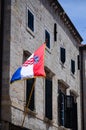 Beautiful old house with the croatian flag on the main walking street in the old town of Dubrovnik Royalty Free Stock Photo