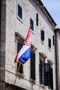 Beautiful old house with the croatian flag on the main walking street in the old town of Dubrovnik Royalty Free Stock Photo