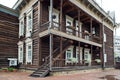 Beautiful old house made of dark wood with carved windows and flower Royalty Free Stock Photo