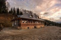 Traditional Wood Cabin House From Bucovina At Sunset Royalty Free Stock Photo