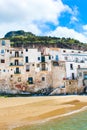 Beautiful old houses overlooking the Tyrrhenian sea in Cefalu, Sicily, Italy. Captured on vertical picture with a rock behind