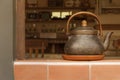 An old kettle on display decorating an old house Royalty Free Stock Photo