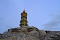 A beautiful old lighthouse with a staircase among the rocks Royalty Free Stock Photo