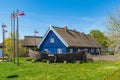 Beautiful old Lithuanian traditional wooden house with boat Royalty Free Stock Photo