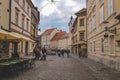 Beautiful, old Ljubljana city streets with people outdoors enjoying festivals in open