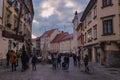 Beautiful, old Ljubljana city streets with people outdoors enjoying festivals in open