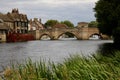 Beautiful old medieval bridge over the Great Ouse with the ancient Bridge chapel from Hemingford Grey water meadow. Royalty Free Stock Photo