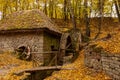 Beautiful old stone mill in the autumn season. Autumn landscape Royalty Free Stock Photo