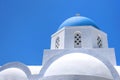 Beautiful old orthodox white church with blue dome against the blue sky, Oia, Santorini, Greece, Europe. Classic white Greek