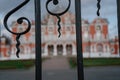 Beautiful old Petrovsky Travel Palace in Moscow behind a wrought iron fence in blur 10.18.2019