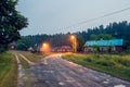 Beautiful, old, polish village with traditional agricultural buildings situated in the middle of the forest in the evening. Royalty Free Stock Photo