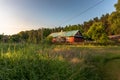 Beautiful, old, polish village with traditional agricultural buildings situated in the middle of the forest in the morning light Royalty Free Stock Photo