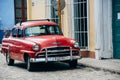 A beautiful old red classic car in Trinidad, Cuba. Royalty Free Stock Photo