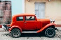 A beautiful old red classic car in Trinidad, Cuba. Royalty Free Stock Photo