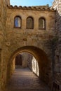 Beautiful old stone arcs in Spanish ancient village, Pals, in Costa Brava