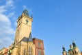 Beautiful Old Town Hall in Prague, Czech Republic photographed during morning golden hour from below. Blue sky above. Historical Royalty Free Stock Photo